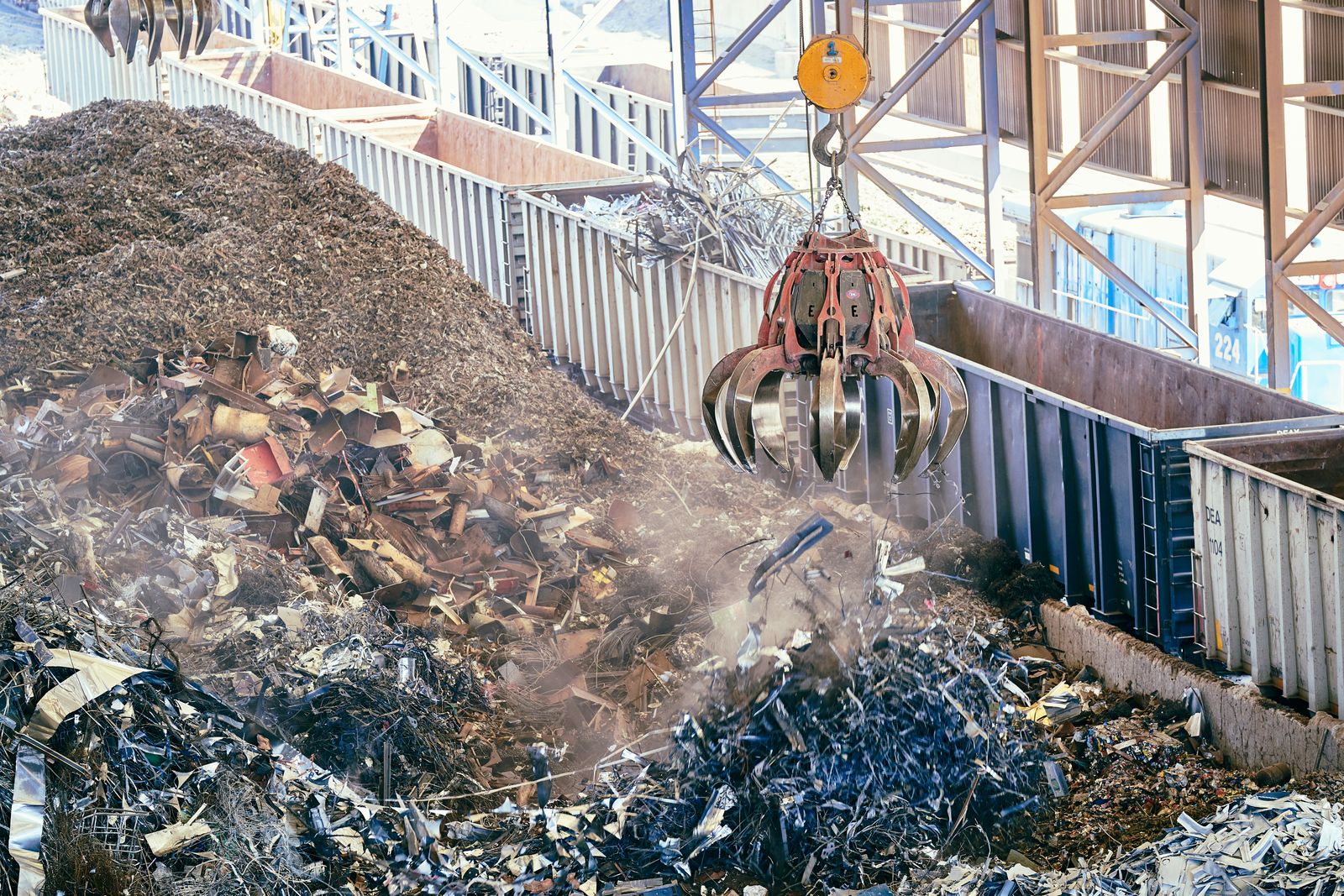Licensed photograph of industrial scrap-metal recovery at a recycling facility.